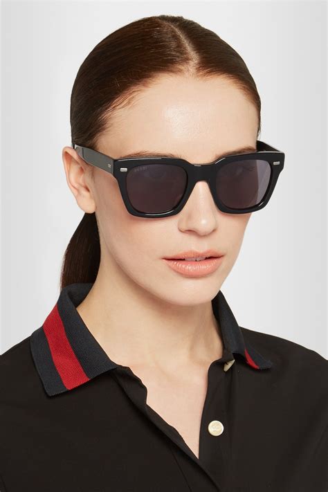 Square frame sunglasses in black .